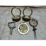 Two brass rein terrets, a swinger, a Pixie horse brass and a whitemetal terret