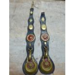 Pair of long leather straps each with a crescent horse brass, brass rein carrier, diamond and oval