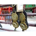 Pair of loin straps each with three horse brasses and brass rings