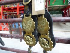 Pair of loin straps each with three horse brasses and brass rings