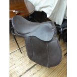 Brown leather saddle, 17ins with studs stamped 'S'