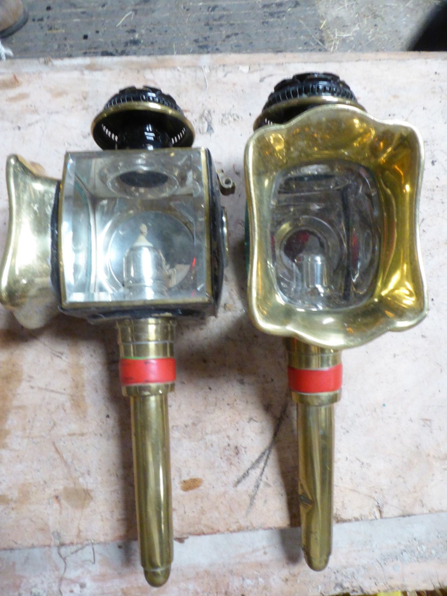 Pair of black carriage lamps with shaped fronts and bevelled lenses