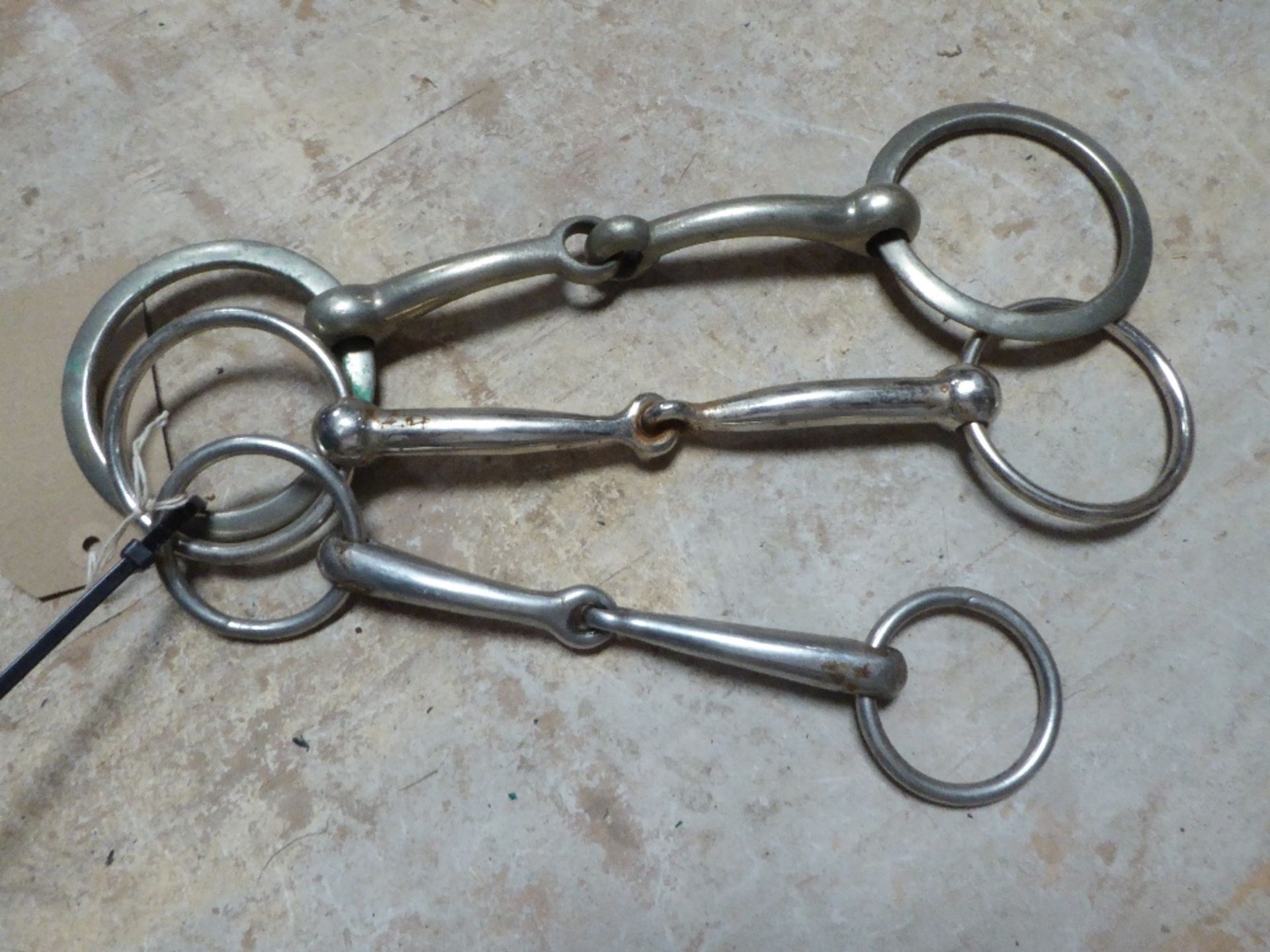 Three loose ring snaffles - 7½ins, 6½ins and 5¾ins