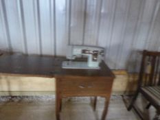 A SEAMSTRESS electric sewing machine with table