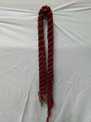 Five black and red lead ropes with brass clasps