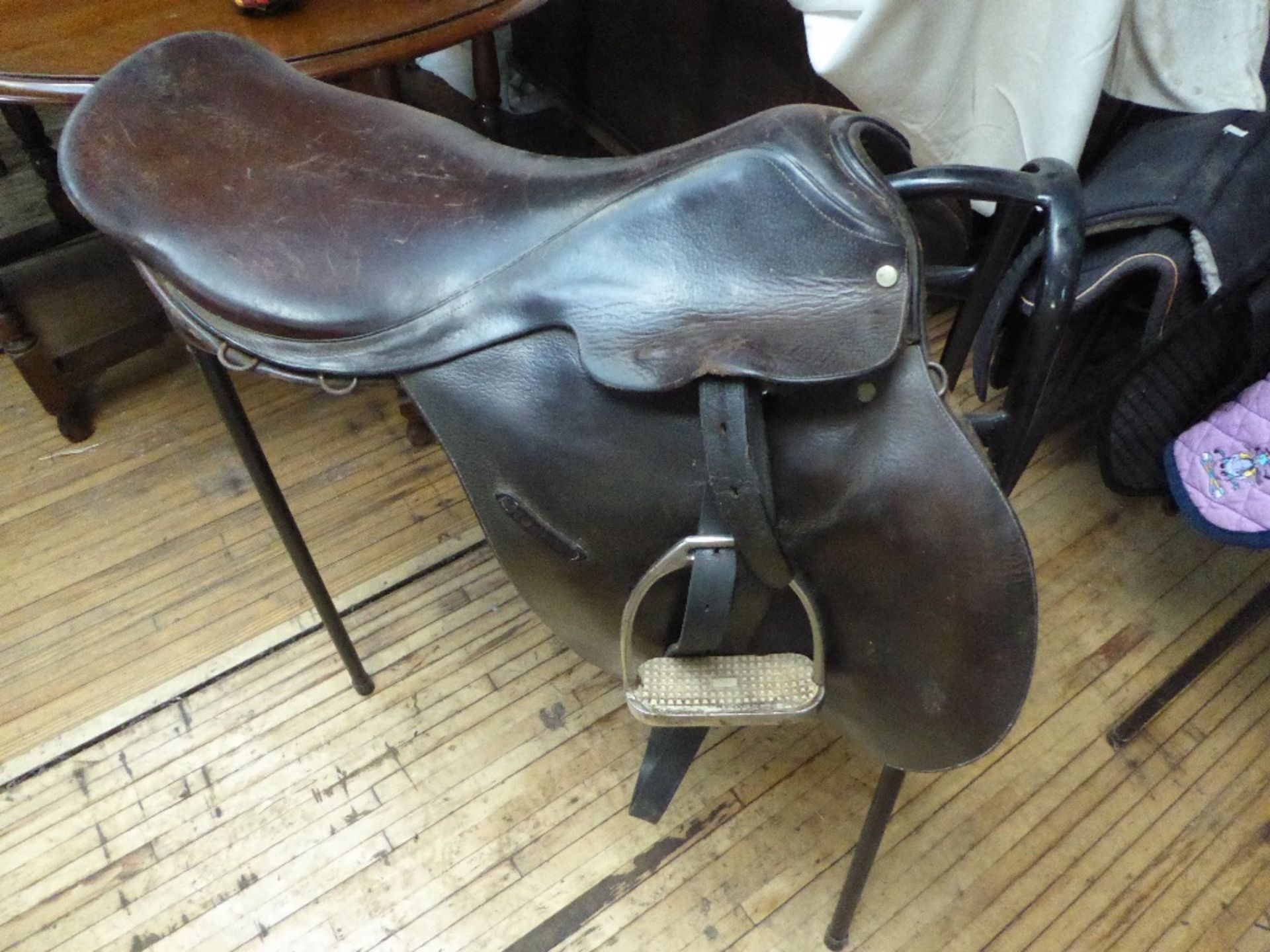Brown leather saddle, 18ins with stirrups and leathers