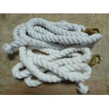 Two white lead ropes with brass catches