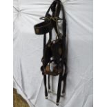 Black agricultural bridle with a driving bit, studs and bearing rein with bit