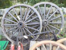 a cranked axle and a pair of metal tyred wheels