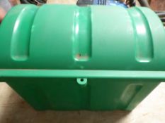 Green plastic trunk containing assorted show cleaning products e.g. sweat scraper, hoof oil, etc.