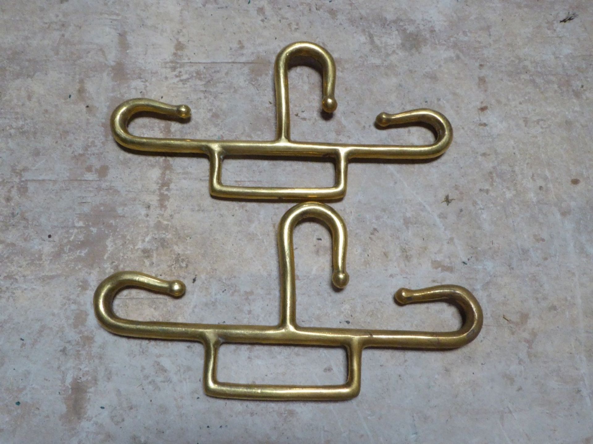 Pair of brass trace hooks