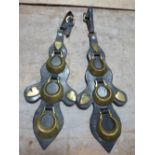 Pair of unusual shaped leathers each with three crescent horse brasses, three heart studs and