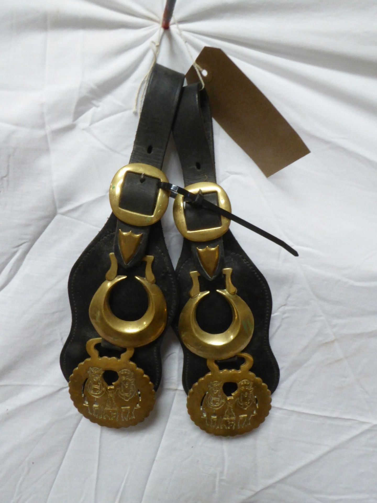 Pair of kidney straps each with two horse brasses