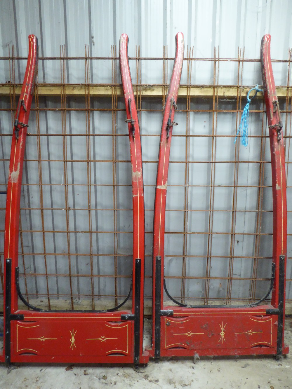 Pair of matching Rully shafts painted red with cream lining. Overall length 8ft, plus a stretcher