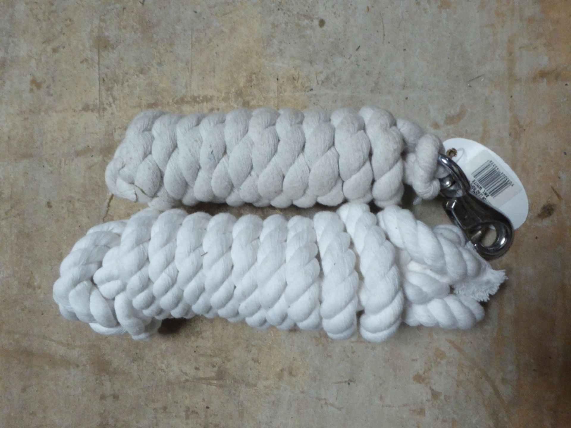 Two white lead ropes with whitemetal catches