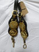 Pair of kidney straps each with two horse brasses