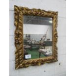 Gilt carved wood framed wall mirror, 66cms x 56cms. Estimate £50-70
