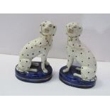 A pair of Staffordshire Dalmatian dog figurines. Estimate £80-120