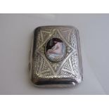 Gentleman's cigarette case, heavily decorated & with an oval enamel plaque of a naked lady,