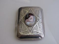 Gentleman's cigarette case, heavily decorated & with an oval enamel plaque of a naked lady,
