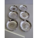 4 sterling silver dishes with coins to base, marked sterling Hong Kong & 2 silver coloured metal