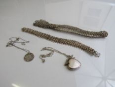 Silver locket on a silver coloured necklace; silver Victorian threepenny bit on silver