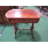 Mahogany swivel top games table, centre stretcher, turned columns to casters, frieze drawer, open