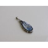 Pale blue tear drop shaped stone in silver coloured metal pendant. Estimate £40-80