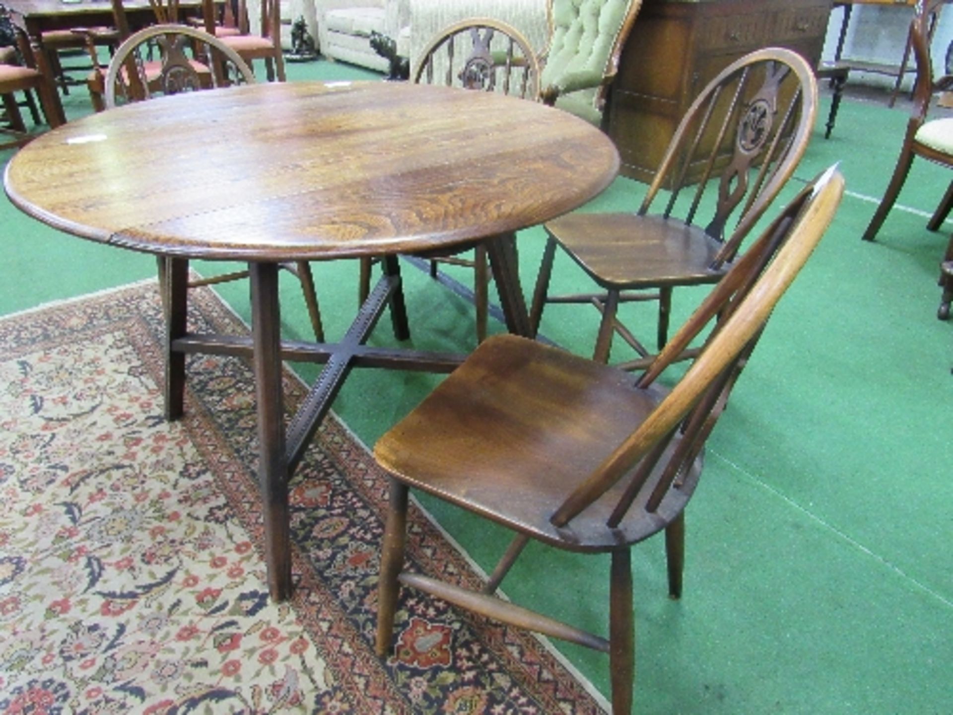 Ercol "Old Colonial" drop-side table with cross stretcher, 107cms diameter (open) x 71cms, with 4 - Image 5 of 6