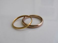 22ct gold wedding band, size M, weight 1.4gms & a 9ct gold wedding band, size M, weight 2.9gms.