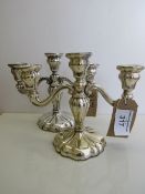 A pair of 3 branch silver candelabra, marked 830x with lion mark, height 23cms, width 28cms,