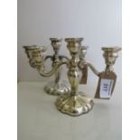 A pair of 3 branch silver candelabra, marked 830x with lion mark, height 23cms, width 28cms,