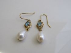Blue Zircon & seed pearl drop earrings. Estimate £250-280