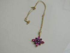 9ct gold, pink & purple star shaped pendant on 9ct gold chain, weight 1.8gms.