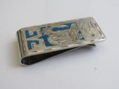 Silver money clip with turquoise inlay. Estimate £5-10
