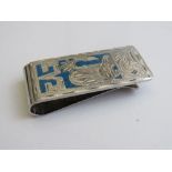 Silver money clip with turquoise inlay. Estimate £5-10