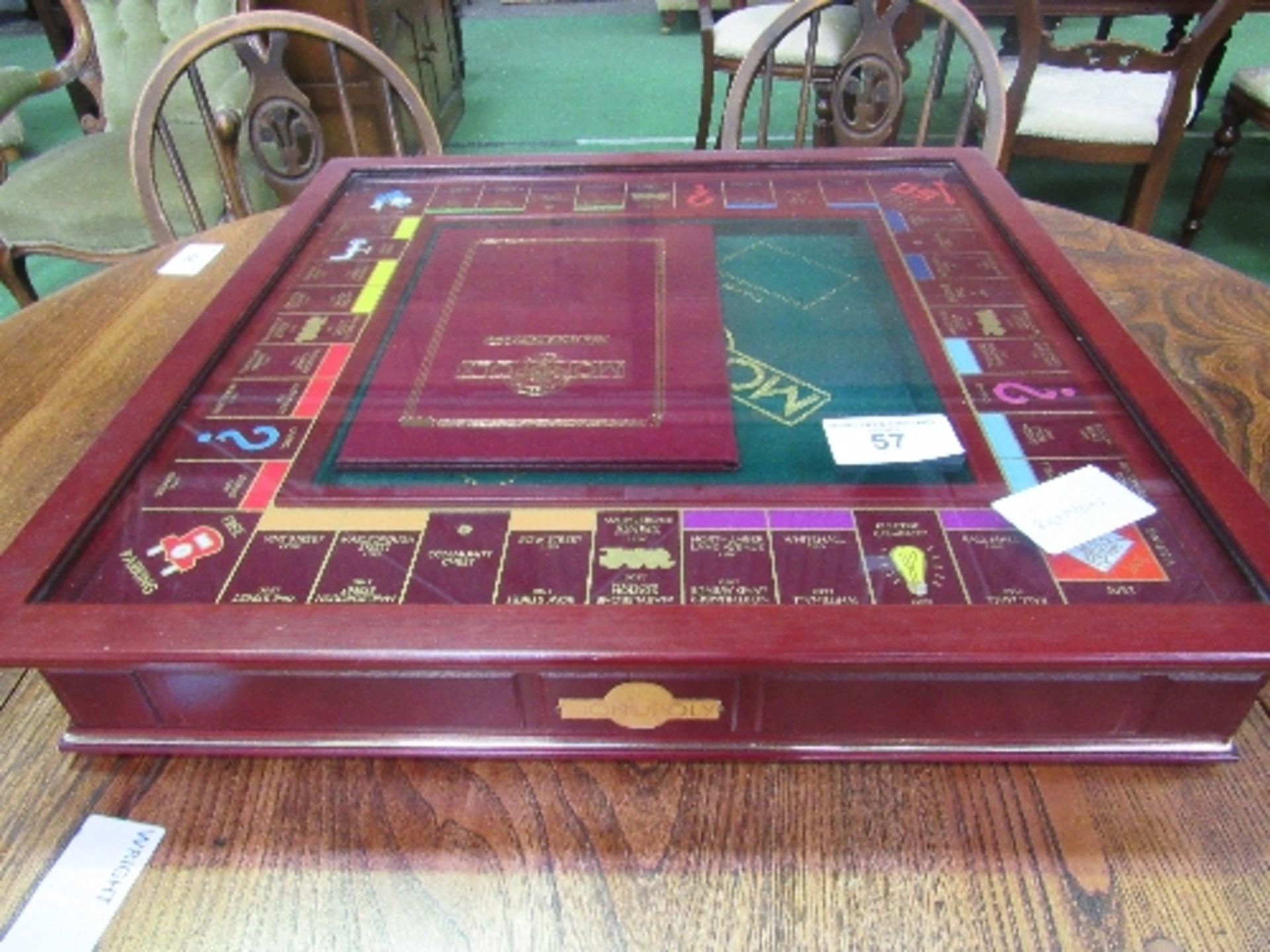 Franklin Mint traditional Monopoly board game in presentation set with glass cover (some cards still