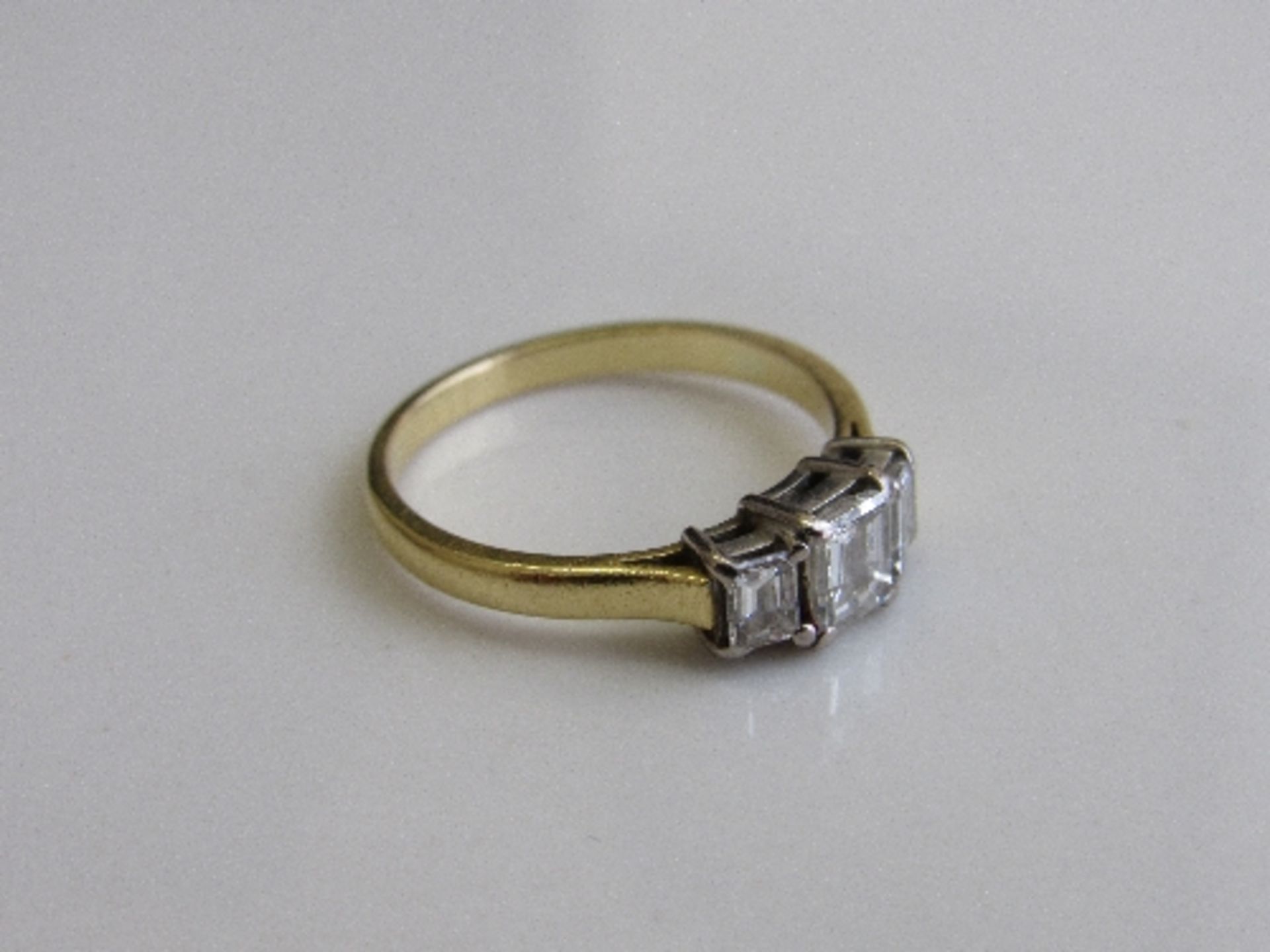 18ct gold & platinum Art Deco-style ring with 3 baguette cut diamonds, size N 1/2, weight 3.3gms.