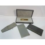 Christian Dior gold plated cigarette lighter in original box. Estimate £50-70