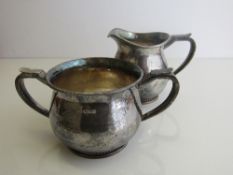 Hallmarked silver milk jug & sugar bowl, London 1998, by Guild of Handicraft, total weight 22oz.