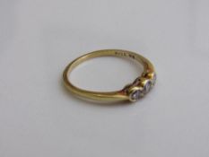 18ct gold ring with 3 diamonds, 0.33ct, size Q, weight 2.3gms. Estimate £100-150