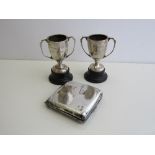 Silver cigarette case, London 1928, weight 4.9oz & 2 small silver golfing trophies on wooden stands.