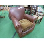 Brown faux leather armchair.