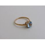 Yellow metal topaz ring, size S, weight 1.9gms. Estimate £50-80