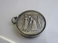 Circular silver vesta case, Birmingham 1906, decorated with Edwardian figures playing croquet,