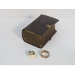 Gold coloured band, miniature leather bound prayer book, 1846 & an ivory button set with coloured