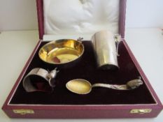 Asprey silver christening set, hallmarked London, 1991 & 1992: bowl, cup, napkin ring & spoon. All