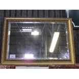 Spackle decorated gilt framed bevel edged wall mirror, 66cms x 90cms. Estimate £20-40