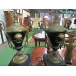 Pair of brass Grecian vase style garnitures with scrolled handles on polished black slate bases,