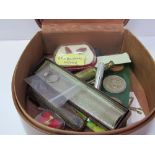 Leather collar box containing a number of small objects including coins, cigarette holders etc.